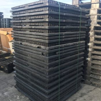 stacked plastic pallets for recycling