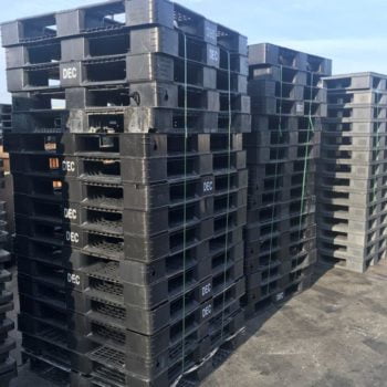 stacked plastic pallets for recycling