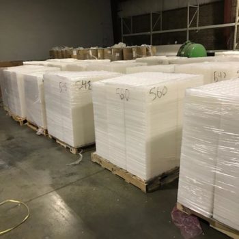 Natural PET Thermoform Trays On Pallets Staged For Recycling