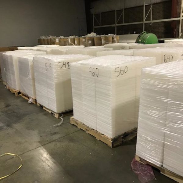 Natural PET Thermoform Trays On Pallets Staged For Recycling